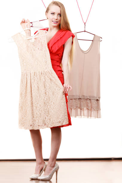 istock Woman in shop or wardrobe picking clothes 1147408697