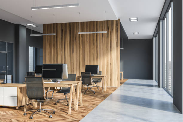 istock Gray and wooden open space office corner 1147409306