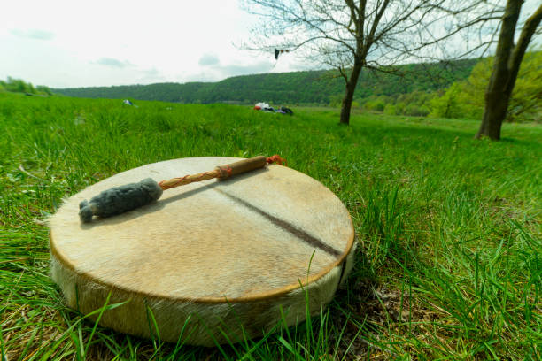 istock man playing a shaman tambourine 1147410823