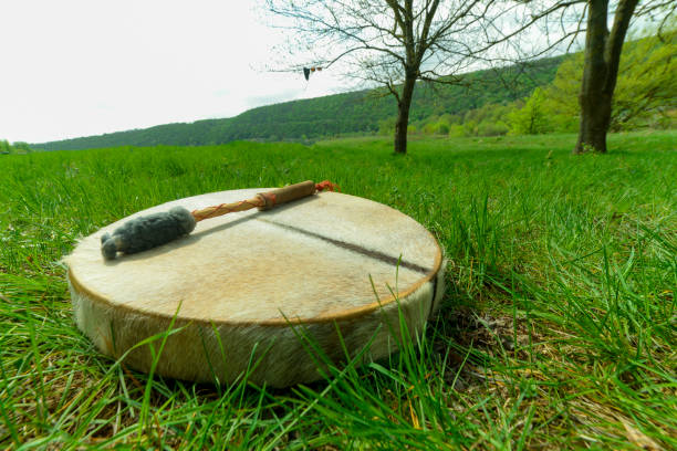 istock man playing a shaman tambourine 1147410831