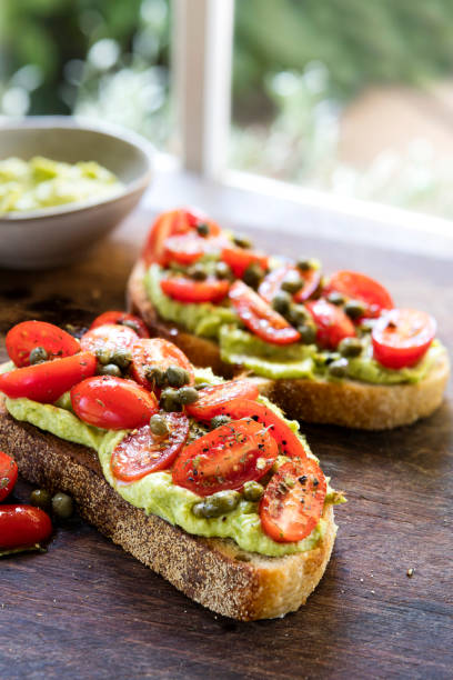 istock Avocado Toast with Cherry Tomato and Caper Salsa 1147412058