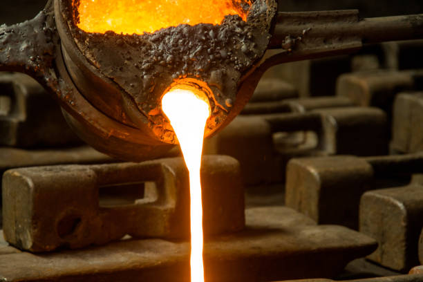 istock metal casting process with red high temperature fire in metal part factory 1147420961