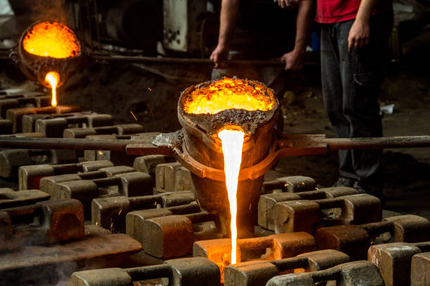 istock metal casting process with red high temperature fire in metal part factory 1147420968