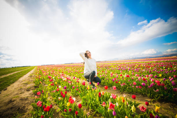 istock young model in a field of tulips 1147421206