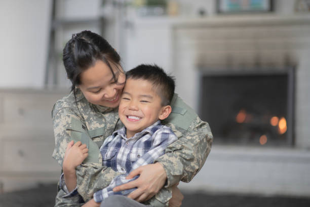 istock Military Mom Hugging Her Son 1147428958