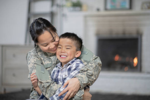 istock Military Mom Hugging Her Son 1147428963