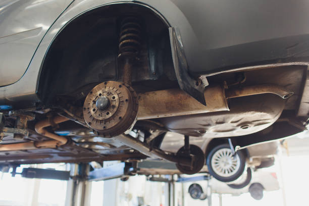 istock Car raised on car lift in autoservice. 1147429196