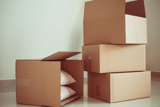 istock Moving boxes in new house 1147430630