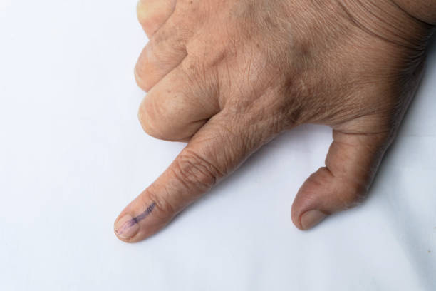 istock Senior citizen voted and got index finger inked 1147439674