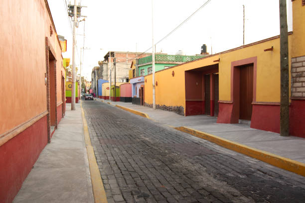 Metepec, State of Mexico, Mexico - 2018: A street at the historic center full of traditional colorful houses.