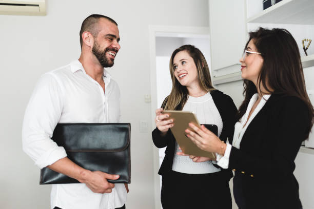 istock Smiling working team meeting in the office 1147441968