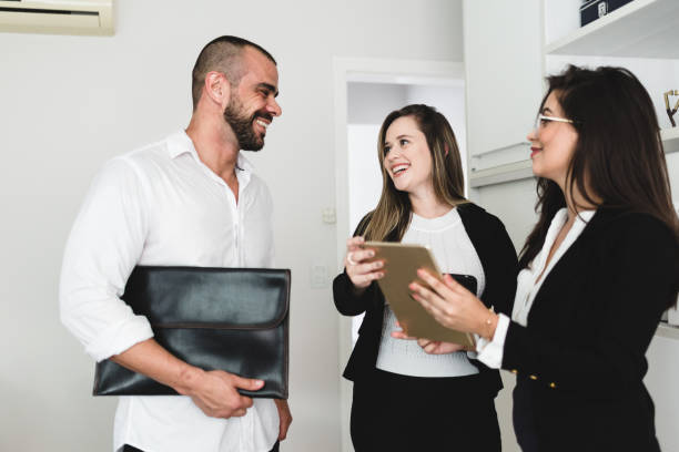 istock Smiling working team meeting in the office 1147441970