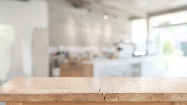 istock Wood table for product display montage in blurred cafe background 1147442102