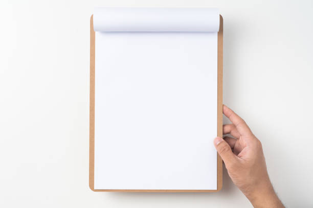 istock white flipped paper on clipboard isolated on white 1147444361