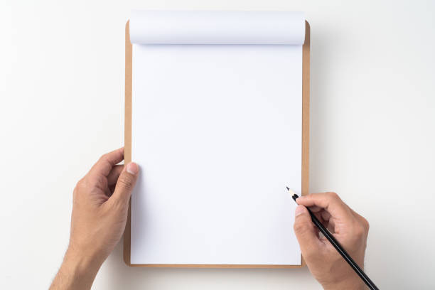 istock white flipped paper on clipboard isolated on white 1147444365
