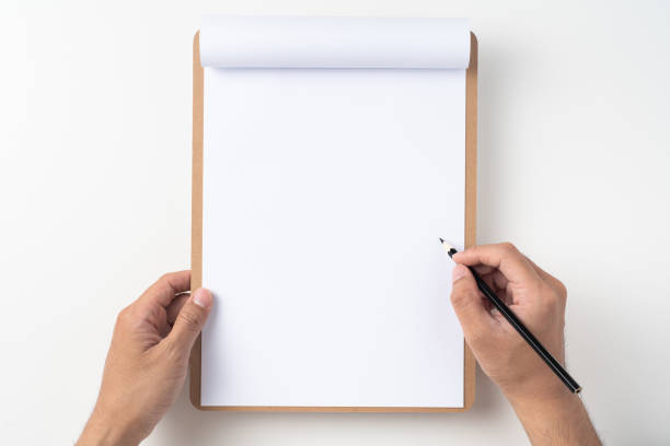istock white flipped paper on clipboard isolated on white 1147444370