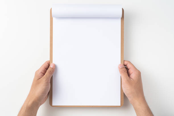 istock white flipped paper on clipboard isolated on white 1147444376