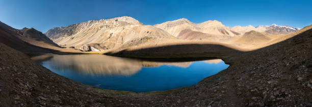 Andes mountains in the extreme south of the planet rising almost 7,000 masl with Aconcagua mount. It is amazing to enjoy it valleys, it wilderness, it loneliness and its amazing landscapes that impress your senses with the power of nature. Chile. la laguna de los patos en la cordillera central de los andes una increíble representación del típico paisaje andino en chile. increíbles vistas a la montaña más alta del sur de los 6, 000m cerro marmolejo. un impresionante paisaje accidentado y color