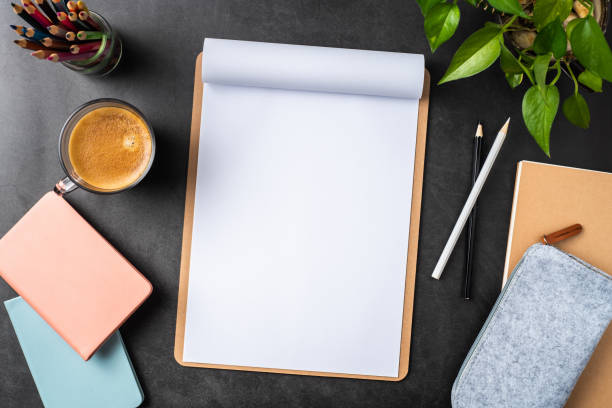 istock white paper with clipboard on black background 1147445372