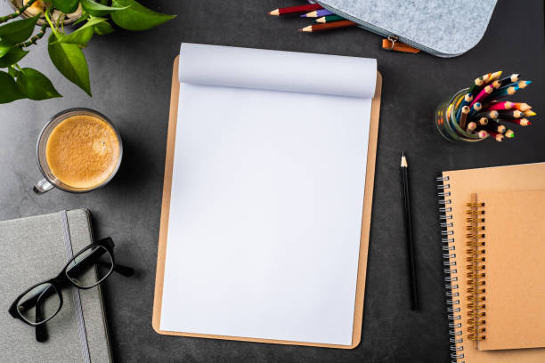 istock white paper with clipboard on black background 1147445444