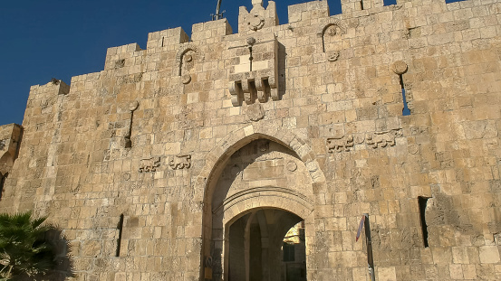 close up of the lion gate entrance to the old city of jerusalem in israel