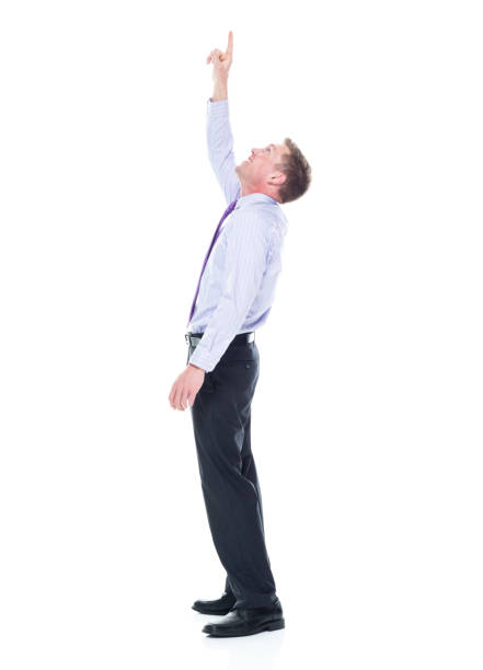 istock Handsome businessman dressed in nice clothing - pointing up 1147457462