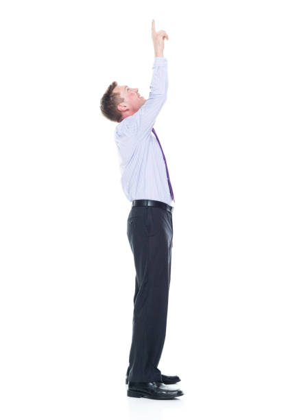 istock Handsome businessman dressed in nice clothing - pointing up 1147457745