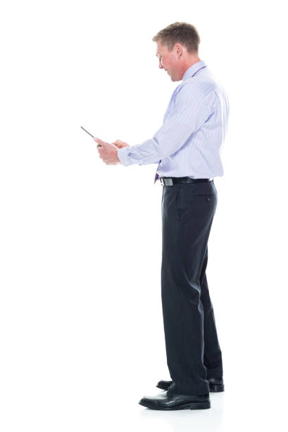 istock Handsome businessman dressed in nice clothing - using tablet 1147459531