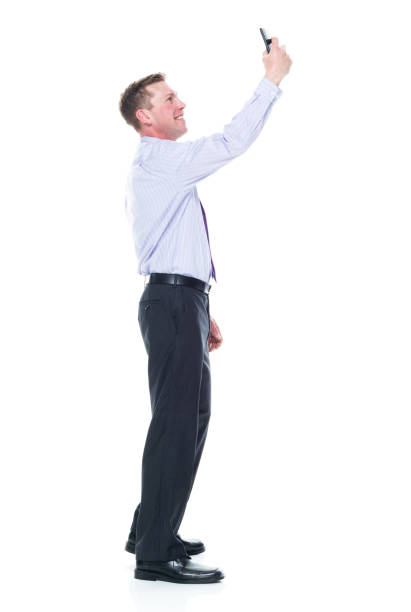 istock Handsome businessman dressed in nice clothing - taking a selfie 1147459535