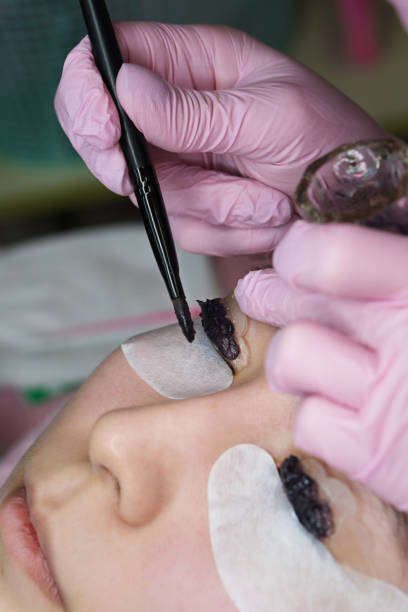 istock Eyelash Extension Procedure. Woman Eye with Long Eyelashes 1147461883
