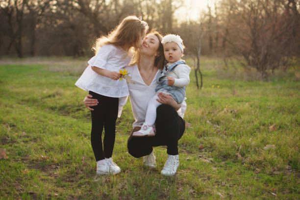 istock Happy family walks in the spring meadow 1147462527