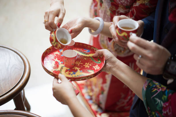 istock Newlywed serving tea to elder on Chinese traditional tea ceremony 1147466934