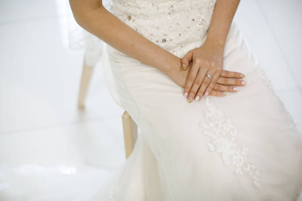 istock Bride dressed in white wedding gown waiting for bridegroom 1147466947