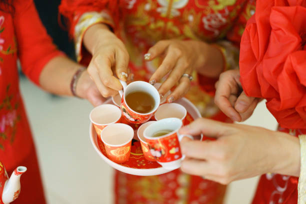 istock Newlywed serving tea to elder on Chinese traditional tea ceremony 1147466986