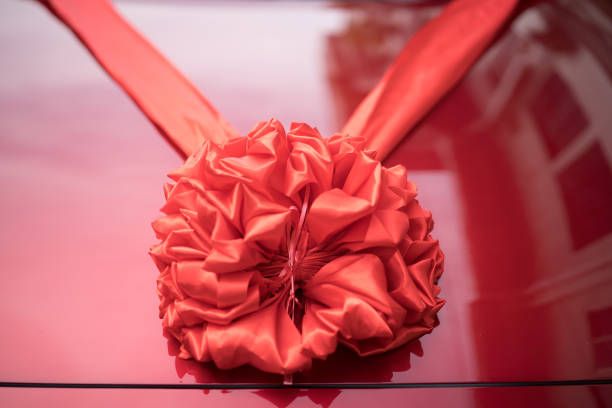 istock Wedding car decoration red ribbon 1147467163