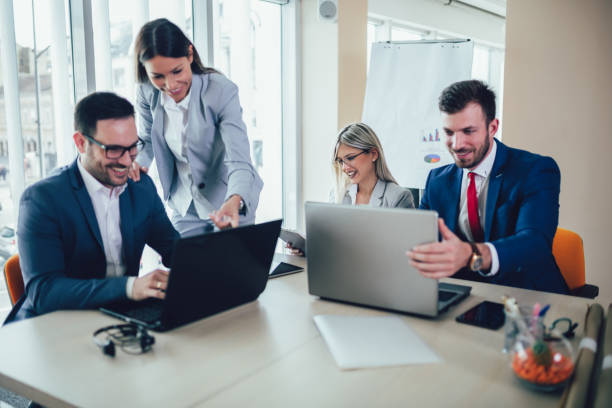 istock Group of young business people working together in creative office. 1147468113