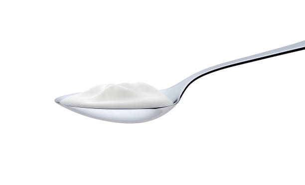 istock Cream in spoon isolated on white background with clipping path. 3d render 1147469487