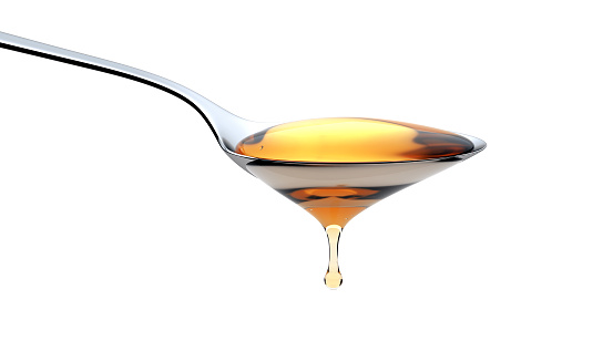Honey pouring from a spoon isolated on white background. Clipping path. 3d render
