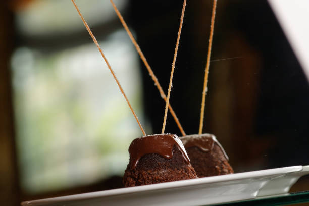 istock Muffin with melted chocolate accompanied by strawberries and mango. 1147469716