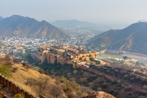 View of Amber fort and palace in Maotha Lake from Jaigarh Fort. Jaipur. Rajasthan. India