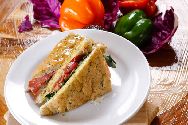 istock Traditional bread sandwich with serrano ham, cheese and spinach leaves. 1147470677