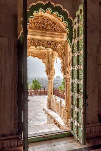 Jaipur city palace balcony seen through an open door