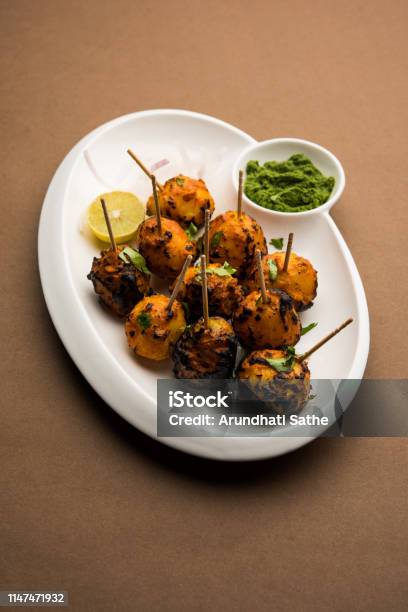 Tandoori Aloo Are Roasted Potatoes With Indian Spices Its A Party Appetiser Served With Green Chutney Selective Focus Stock Photo - Download Image Now