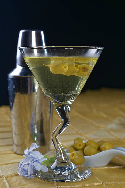 The martini is a cocktail made with gin and vermouth, and garnished with an olive or a lemon twist. Over the years, the martini has become one of the best-known mixed alcoholic beverages.