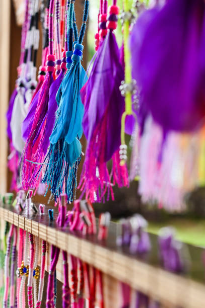istock colored feathers of Indians in the storefront. Copy space, 1147472280