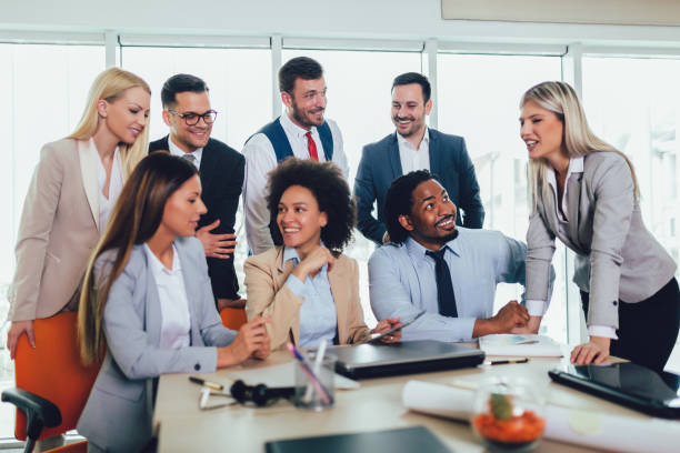 istock Group of young business people working together in creative office. 1147473302