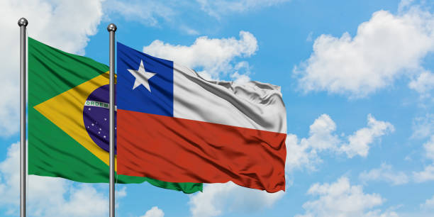 Brazil and Chile flag waving in the wind against white cloudy blue sky together. Diplomacy concept, international relations. Brazil and Chile flag waving in the wind against white cloudy blue sky together. Diplomacy concept, international relations. consul photos stock pictures, royalty-free photos & images