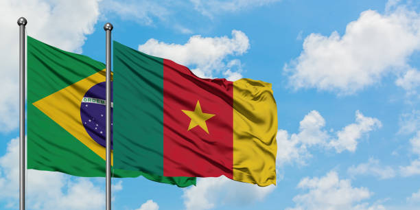 Brazil and Cameroon flag waving in the wind against white cloudy blue sky together. Diplomacy concept, international relations. Brazil and Cameroon flag waving in the wind against white cloudy blue sky together. Diplomacy concept, international relations. yaounde photos stock pictures, royalty-free photos & images