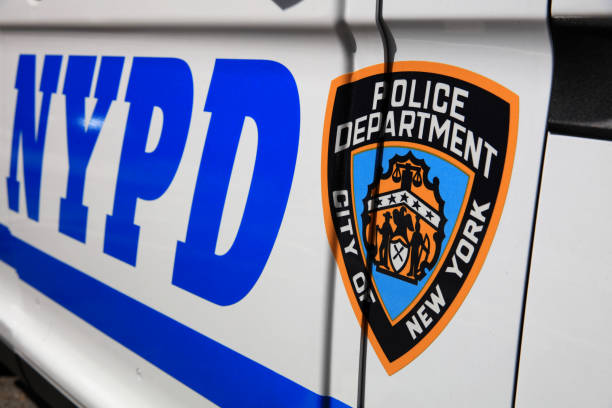 NYPD (New York Police Department) Sign with Logo on Police Patrol Car in New York City. USA stock photo