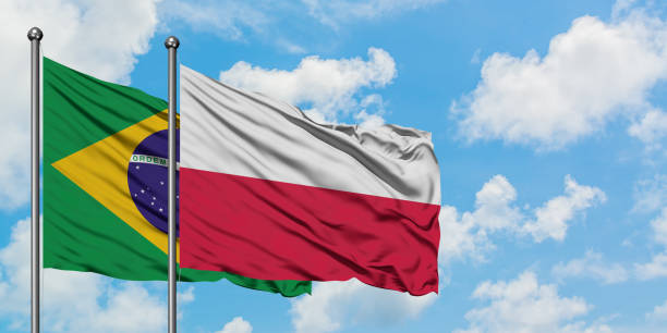 Brazil and Poland flag waving in the wind against white cloudy blue sky together. Diplomacy concept, international relations. Brazil and Poland flag waving in the wind against white cloudy blue sky together. Diplomacy concept, international relations. consul photos stock pictures, royalty-free photos & images
